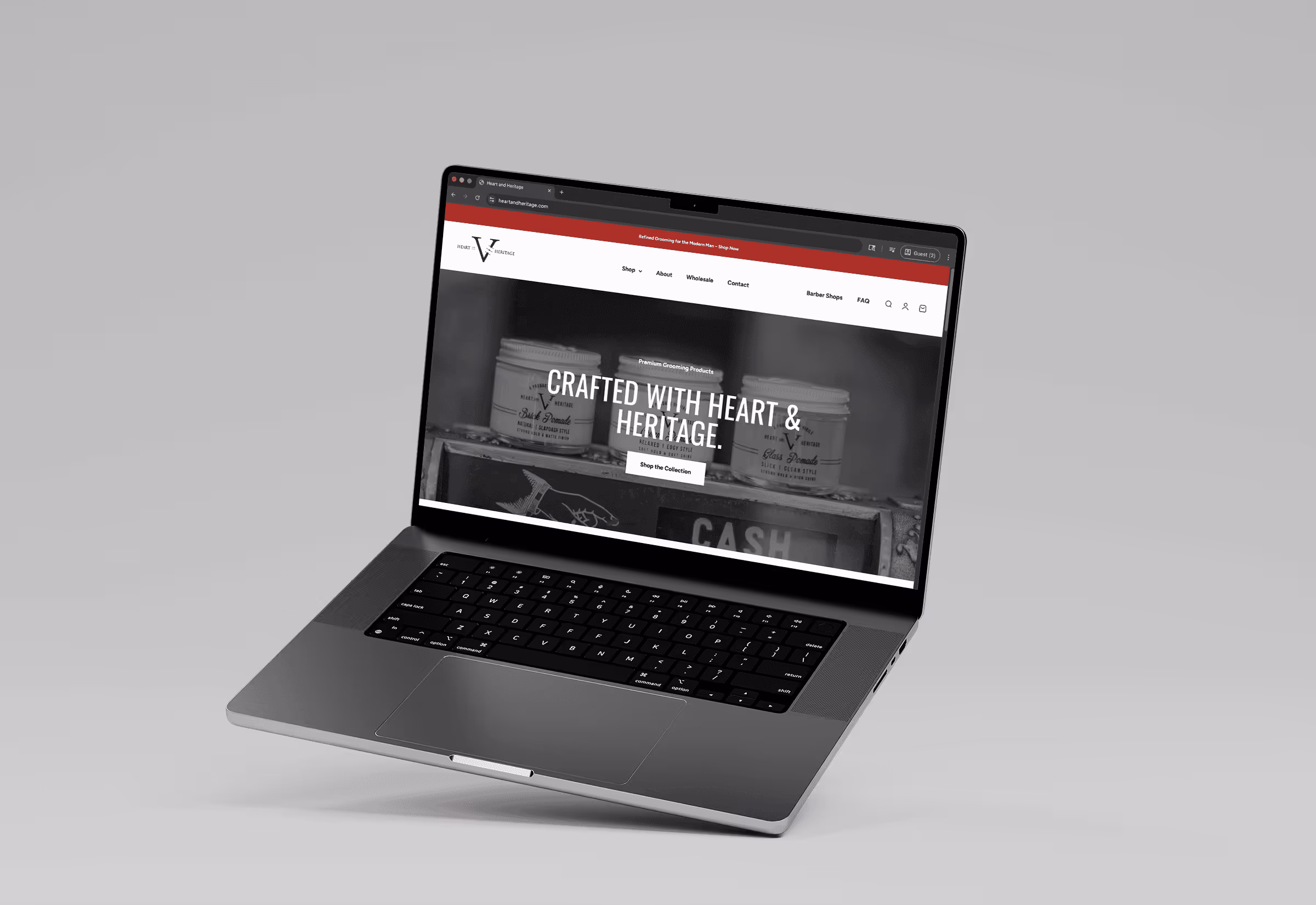 Open laptop displaying a website with the text 'Crafted with Heart & Heritage' and product jars in the background.