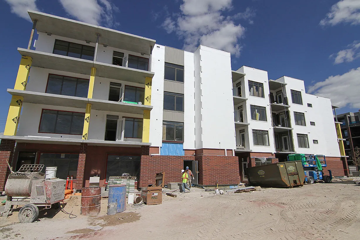 Winnipeg apartment building under construction with exterior finishes underway