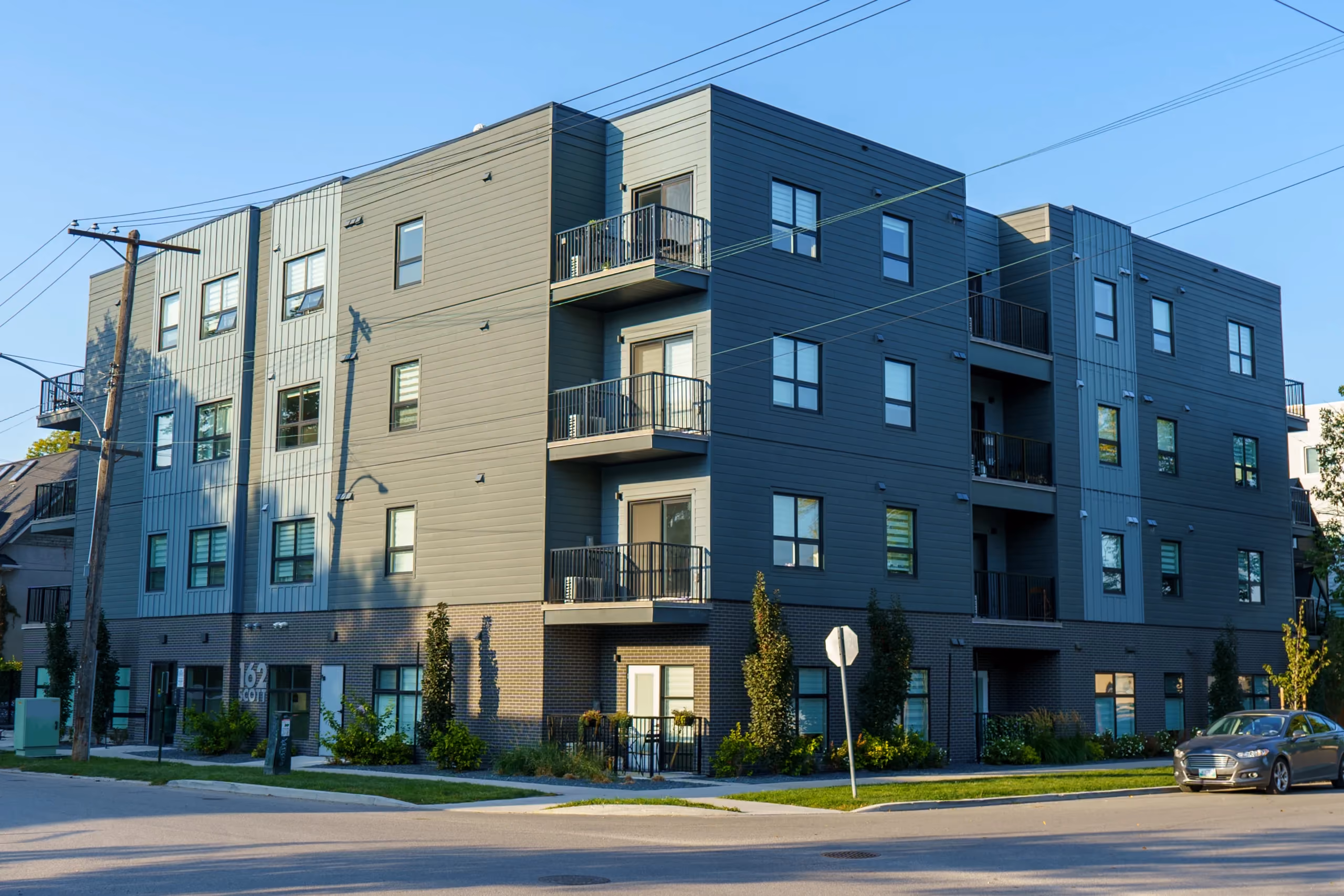 162 Scott Street in Winnipeg, a four-storey infill apartment building on the corner