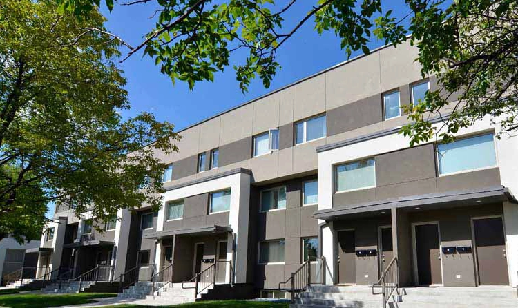 Row of modern Winnipeg townhouses with individual street entries