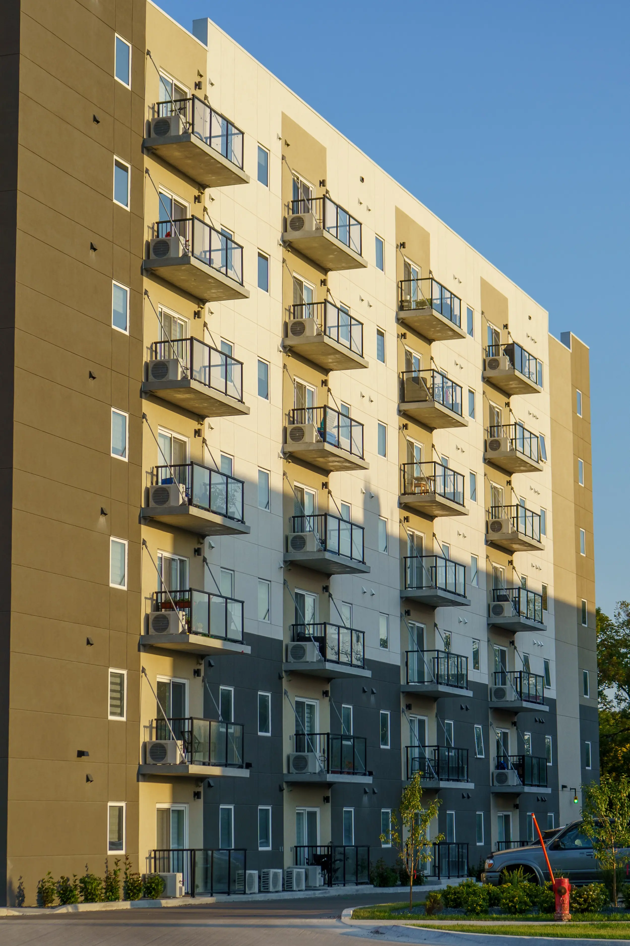 Yellow and charcoal cladding with balconies at 2140 Portage Avenue in Winnipeg