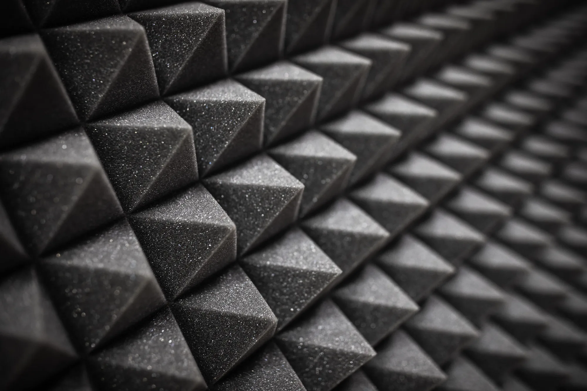Close view of pyramid-profile acoustic foam panelling used for sound baffling