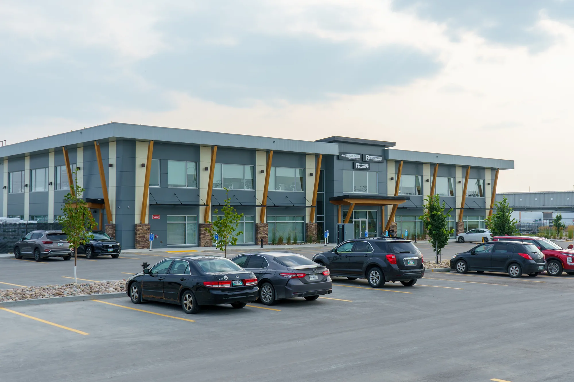 570 Rue Camiel Sys Street in Winnipeg, a two-storey institutional building seen from the parking lot