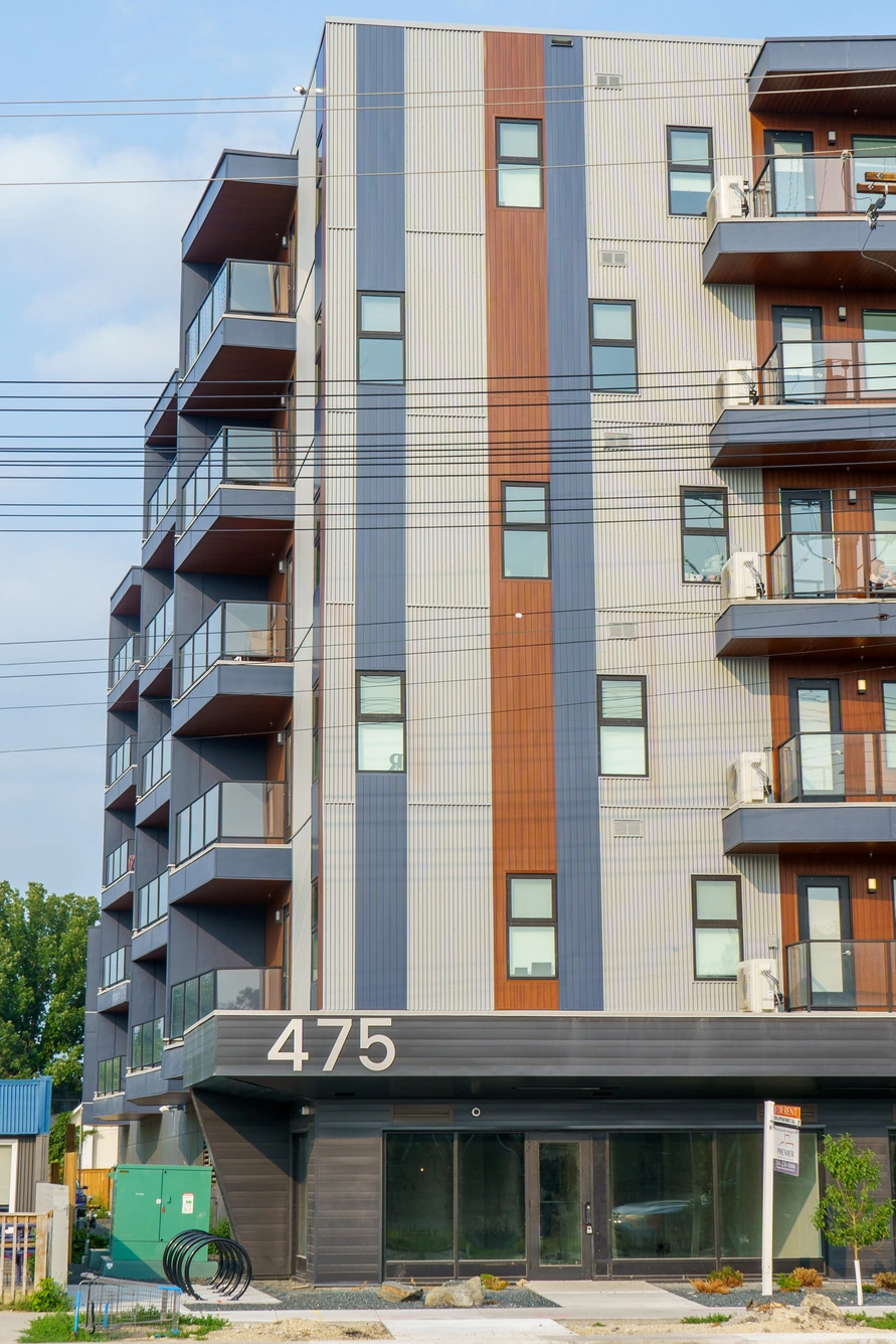 Balconies and accent cladding above the retail entrance at 475 St. Anne's Road in Winnipeg