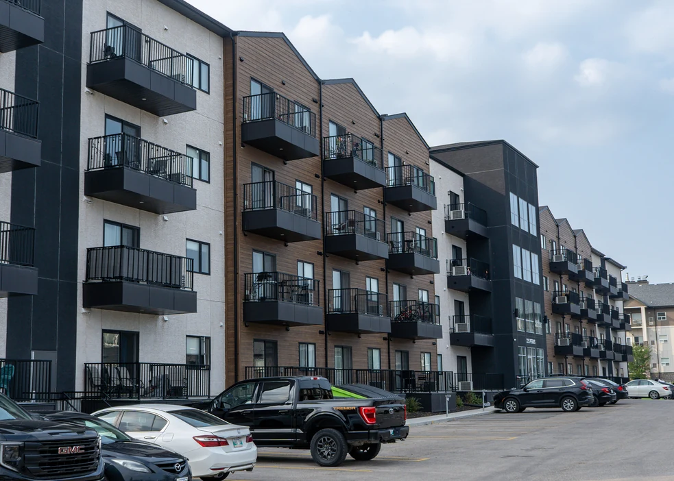 225 Peguis Street in Winnipeg with balconies above the parking court