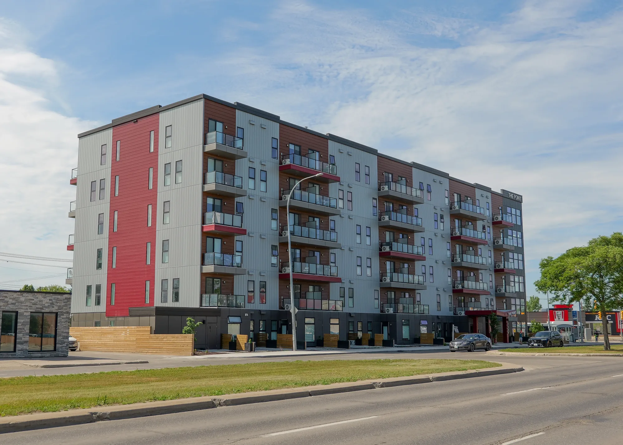 The Point at 1125 Pembina Highway in Winnipeg with retail units at street level