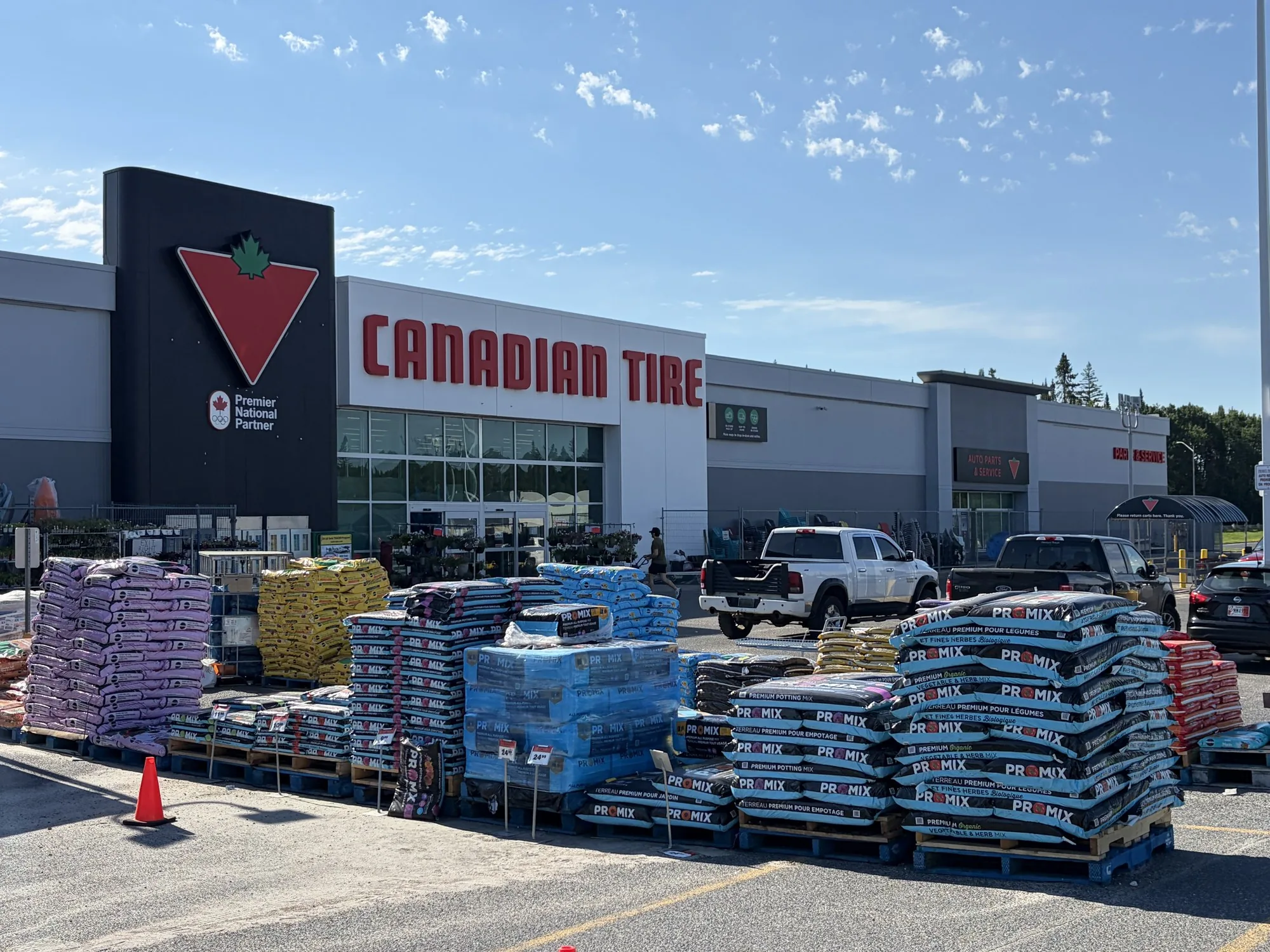Canadian Tire garden centre in Winnipeg with pallets of soil and mulch stacked outside