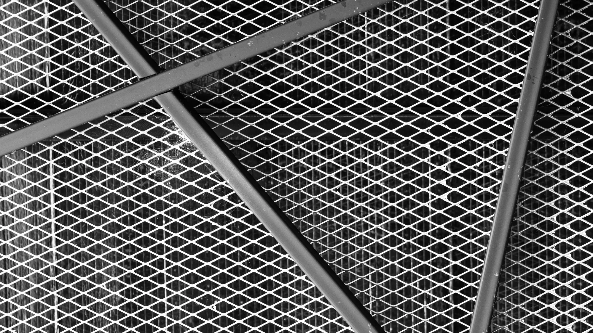 Expanded metal lath fixed to a steel ceiling grid, ready for plaster
