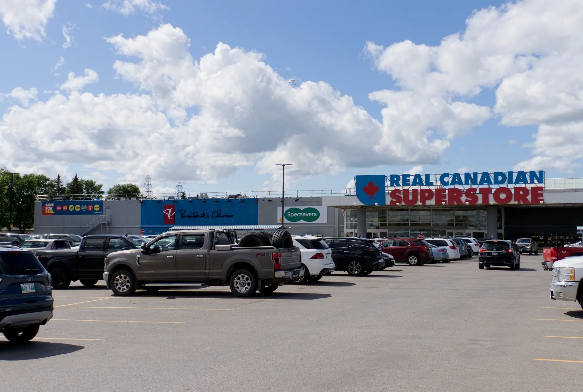 Real Canadian Superstore in Winnipeg seen across the parking lot with the main entrance signage
