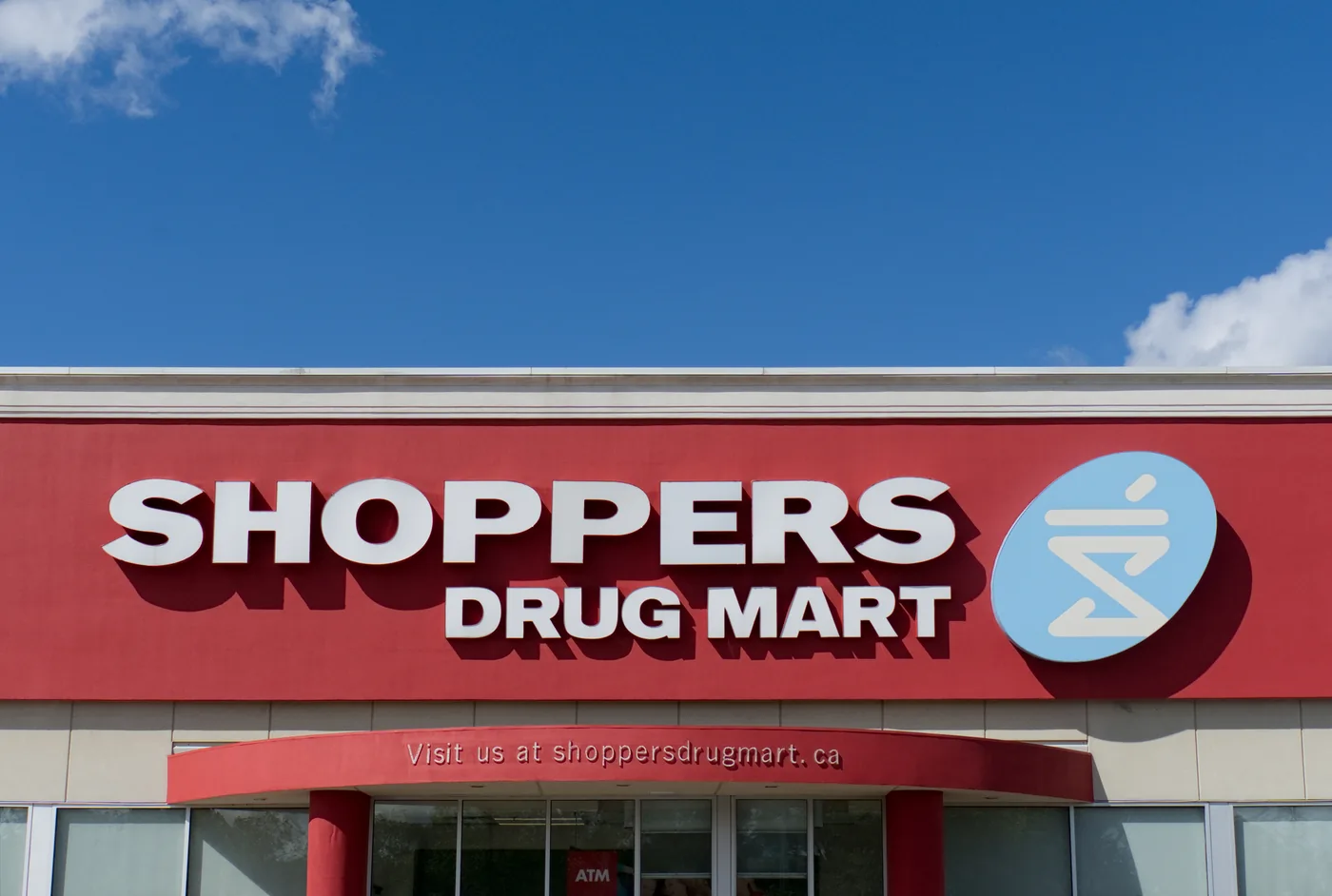 Close view of the Shoppers Drug Mart signage bulkhead and finished fascia in Winnipeg