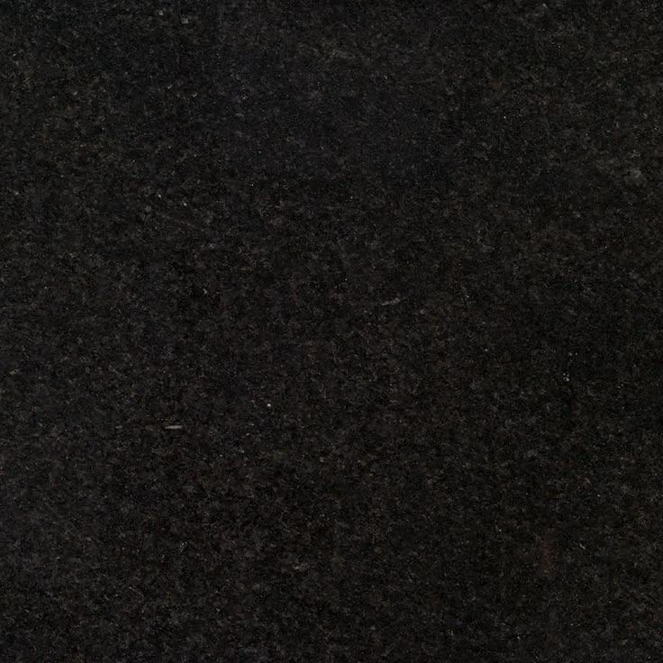 This may contain: a black granite counter top that is very dark