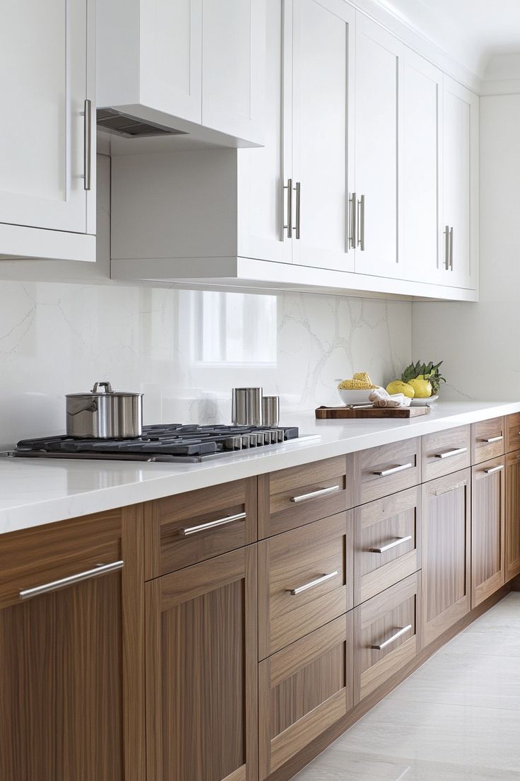 This may contain: a kitchen with wooden cabinets and white counter tops