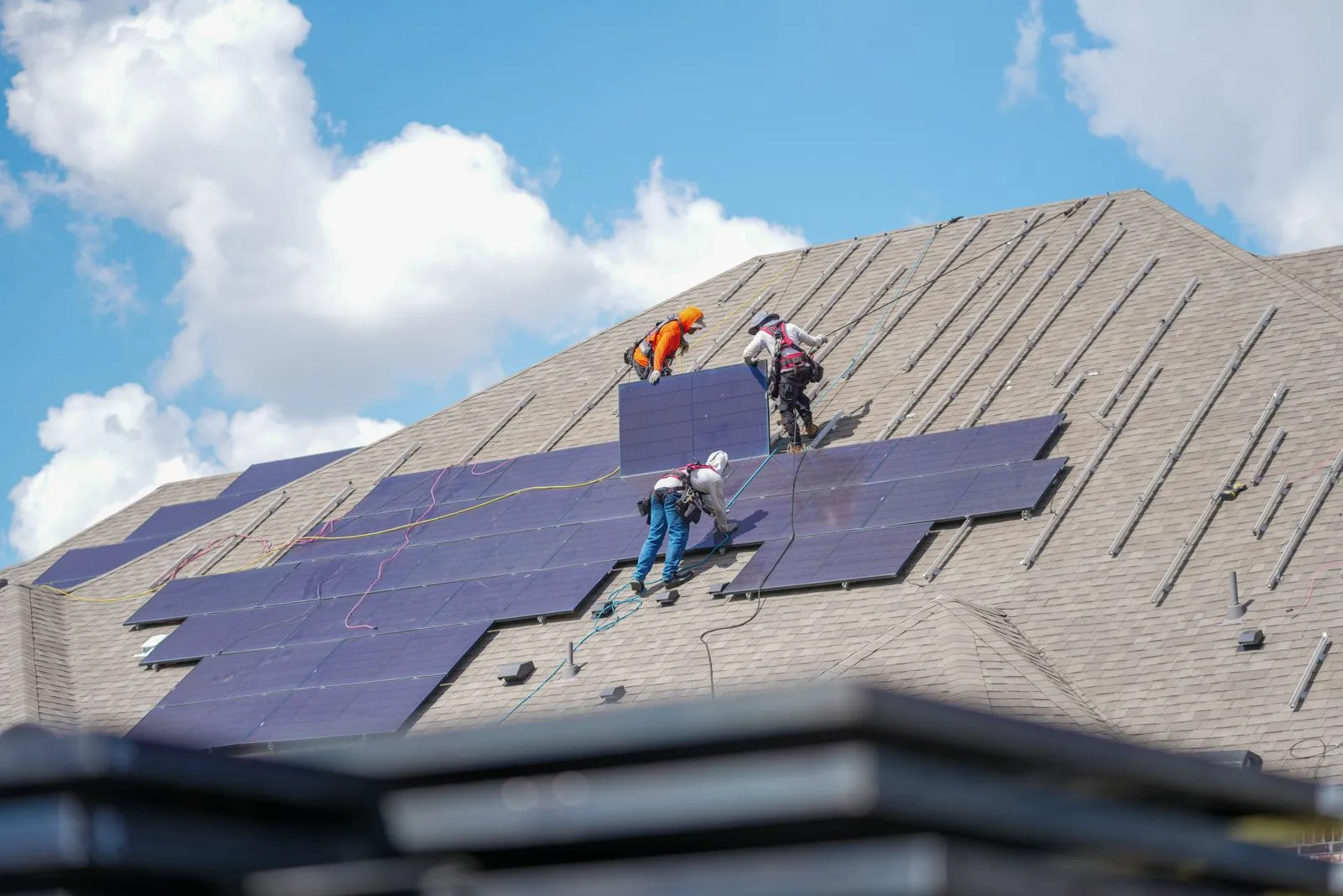 Solar detach and reset contractors removing panels for a roof replacement in North Texas