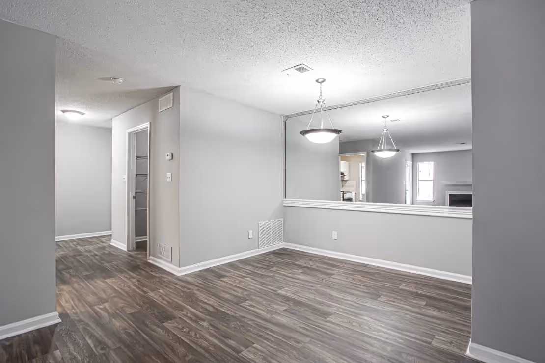 dining area with mirror on wall