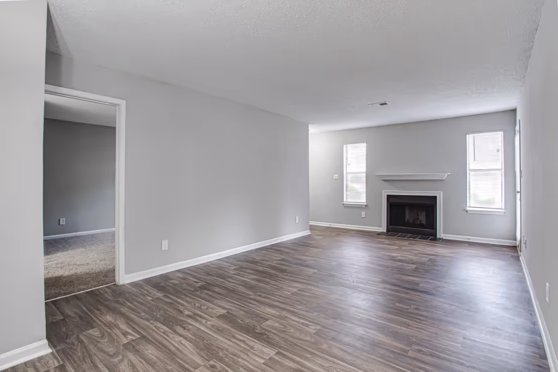 unfurnished living area with fireplace 