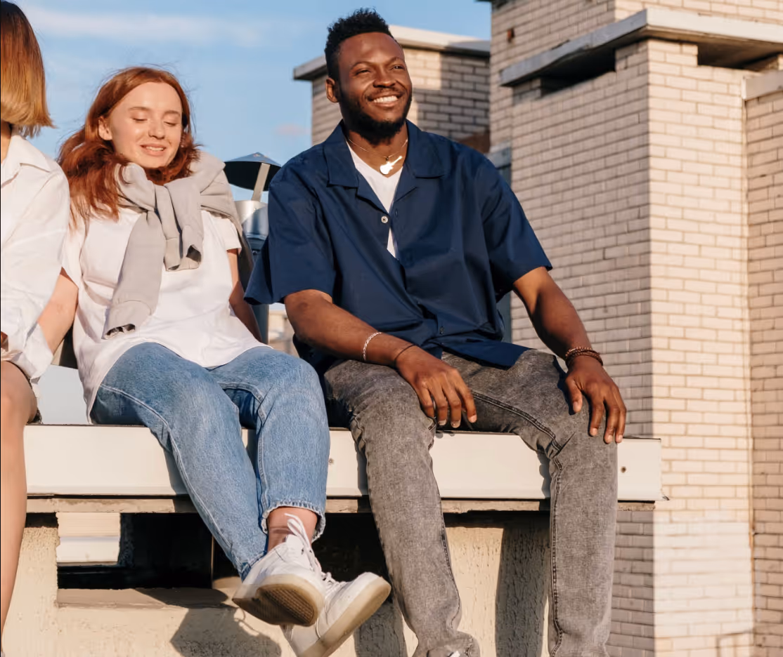 man and woman sitting in sunset stock image