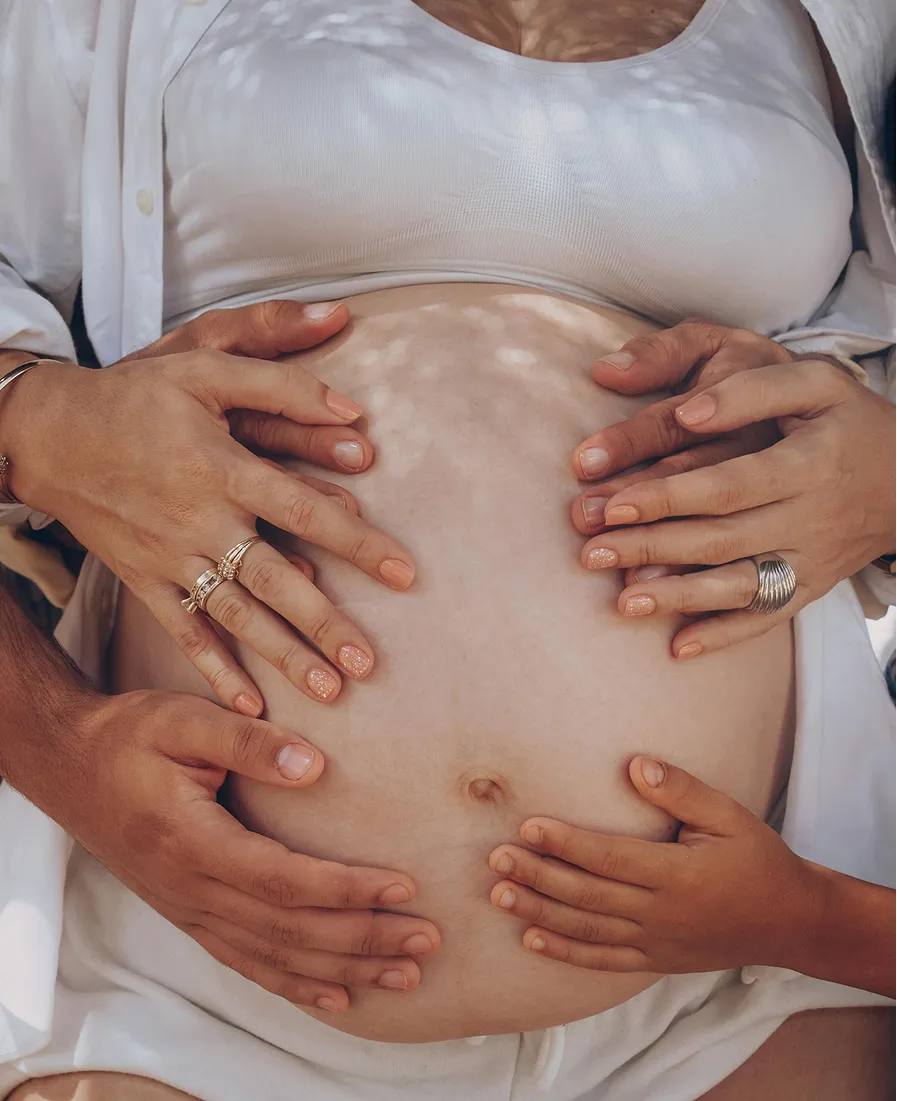 Pregnant woman with family