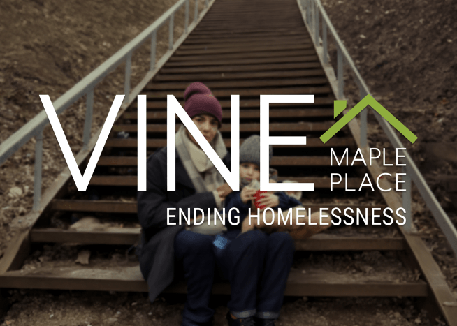 Mother and her child sitting on stair steps with Vine Maple Place, Ending Homelessness logo