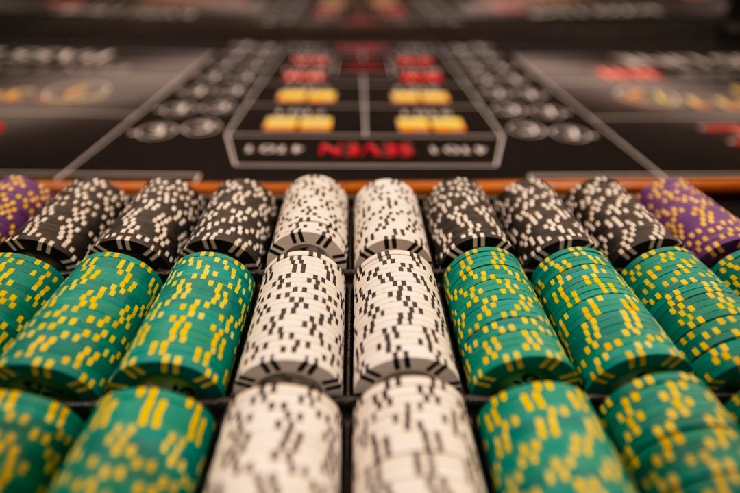 a close up of many different colored poker chips