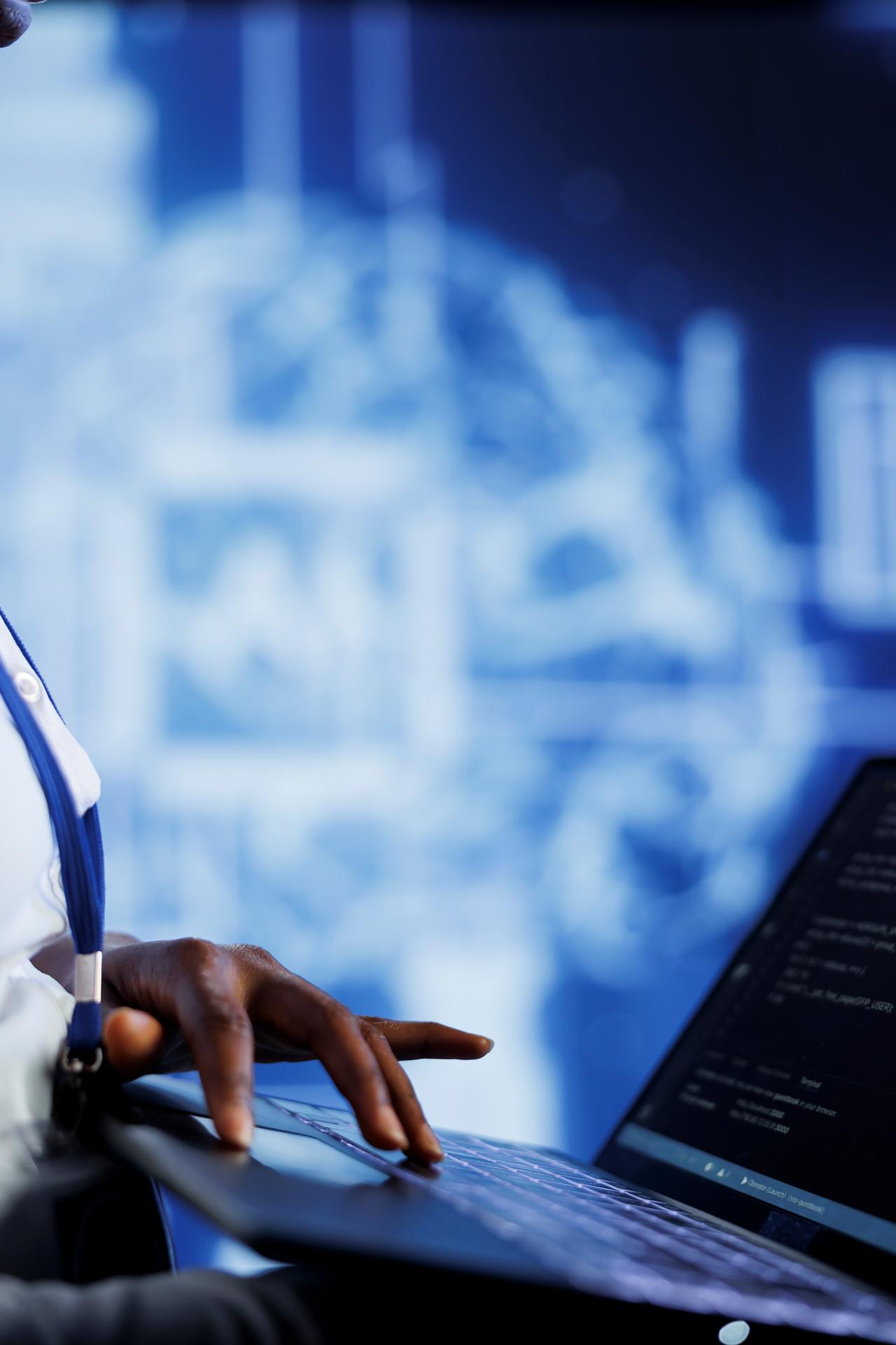 A person typing on a laptop with a blurred digital interface of an AI brain in the background. The scene conveys a tech-focused and innovative atmosphere.