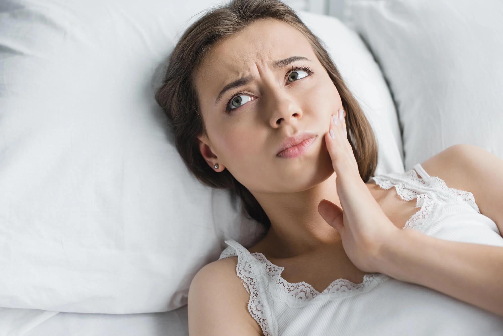 Woman with Toothache Considering Philly Orthodontics