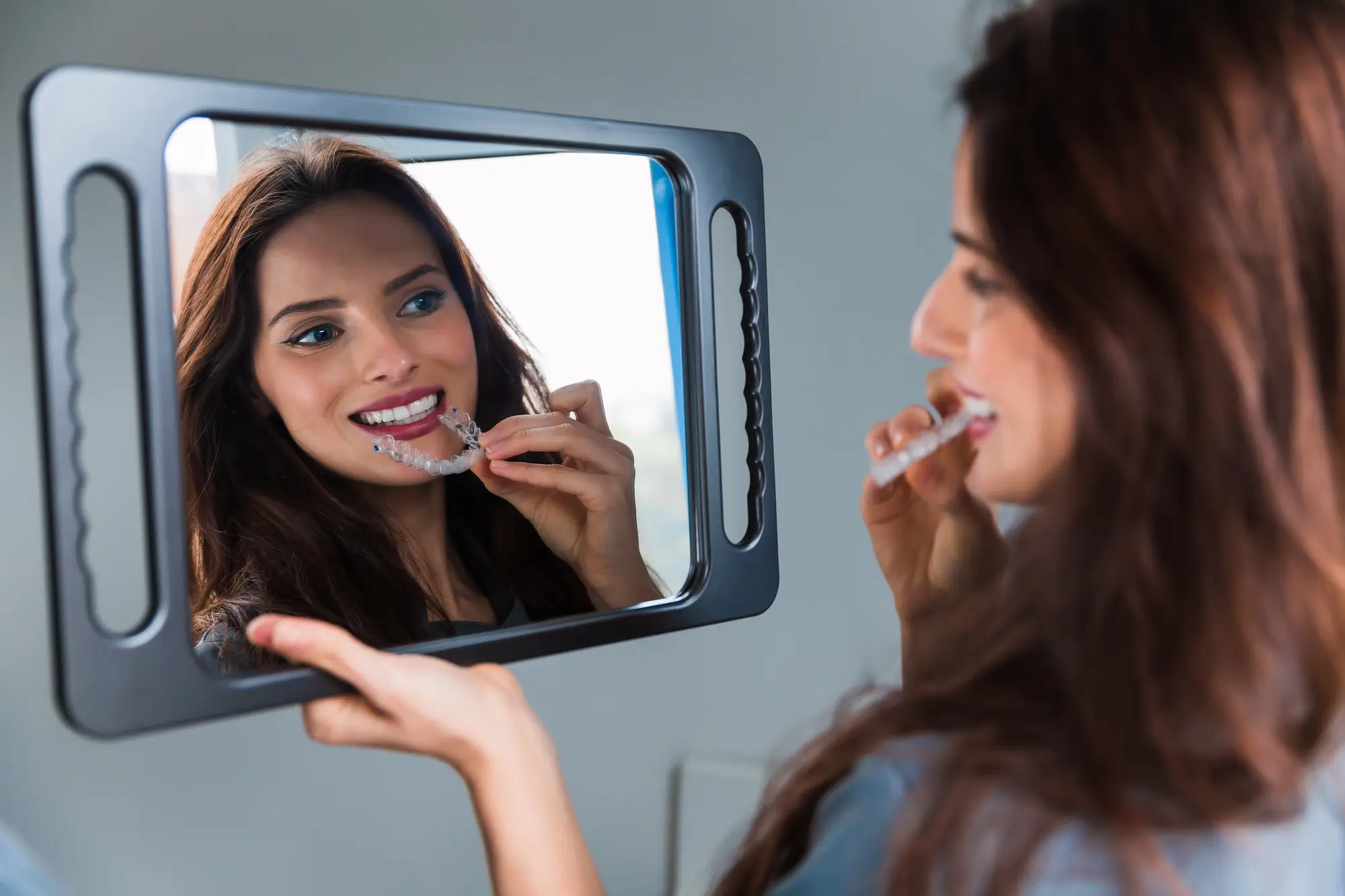 Anyone starting orthodontic treatment usually wants one answer before anything else: how long will it take? For patients considering Invisalign in Philadelphia, the honest answer depends on a few specific factors rather than a single fixed number. Treatment length is not one-size-fits-all, and understanding what drives the timeline helps set realistic expectations from the start. Some patients finish in under a year, while others need extra months to fully align a more complex bite. If you’re considering starting Invisalign treatment, it’s helpful to know what typically speeds up or slows down the process and what a first visit usually reveals about a specific case. What Determines an Invisalign Timeline Case Complexity Matters Most Treatment length depends on the product type, how consistently the aligners are worn, and the complexity of the case, according to the Invisalign® treatment time guidance. Mild crowding or spacing tends to resolve faster than more complex bite issues. How Aligners Move Teeth Over Time The American Association of Orthodontists notes that each aligner is typically worn for one week, for at least twenty-two hours a day, moving teeth a fraction of a millimeter at a time. Multiply that pace across dozens of aligners, and the cumulative shift becomes clear. Typical Timelines by Case Type General ranges patients can expect, though a dental evaluation is the only way to confirm an individual timeline: Mild crowding or spacing: several months Moderate misalignment: around a year More complex bite issues: over a year, sometimes with refinement aligners Why an Initial Exam Sets the Timeline A comprehensive exam is what turns a general range into an actual plan, since digital scans and X-rays reveal the exact movements each tooth needs. Skipping this step, or basing a timeline on guesswork, is one of the most common reasons treatment expectations go wrong. Gum Health Can Affect the Schedule Underlying gum disease may need to be addressed through periodontal care before aligner treatment can begin safely. Treating it first protects both the teeth and the surrounding bone during months of gradual movement. Staying on Schedule Once Treatment Starts Consistent wear is only part of the equation, since plaque can build up around aligners more easily than around natural teeth alone. Keeping up with routine cleanings throughout treatment helps protect enamel and keep the timeline on track. Frequently Asked Questions About Clear Aligner Treatment Can Treatment Ever Take Less Than a Year? Mild cases involving only minor crowding or spacing sometimes finish in several months rather than a full year. A dental evaluation is the only reliable way to know which category a smile falls into. Do Aligners Need to Be Worn All Day? Consistent wear, generally at least twenty-two hours daily, is what keeps a treatment plan on schedule. Removing aligners too often for eating or socializing can extend the total timeline. What Happens After the Aligners Come Off? Retainers are typically needed afterward to keep teeth from shifting back into old positions, and wear time is usually reduced gradually rather than stopped all at once. Regular checkups help confirm that results are holding as expected long after the last aligner is removed. Start Invisalign in Philadelphia at Center City Dental Every smile moves at its own pace, and the team at Center City Dental is happy to map out a realistic timeline for you. Anyone ready to start Invisalign in Philadelphia can schedule a consultation to get an exact treatment plan instead of a guess. *Invisalign®, the Invisalign logo, and iTero®, among others, are trademarks and/ or service marks of Align Technology, Inc. or one of its subsidiaries or affiliated companies and may be registered in the U.S. and/or other countries.