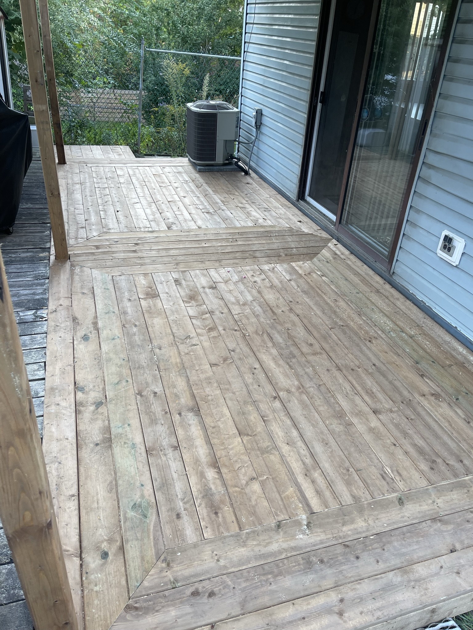 Custom deck construction featuring composite decking, professional railings, and multi-level design in Kitchener.