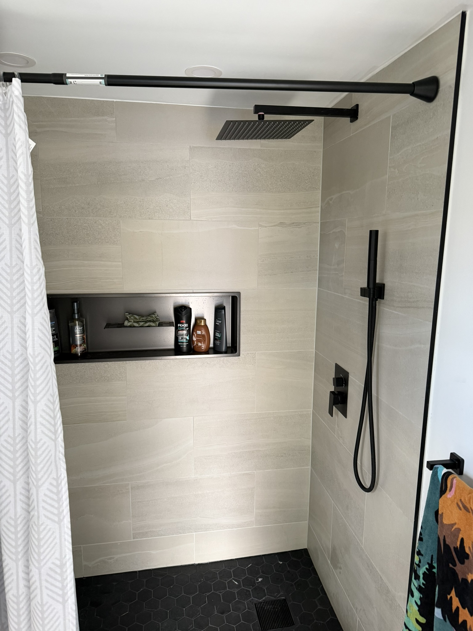 Professional bathroom renovation featuring modern fixtures, custom tile work, and updated plumbing in Kitchener.