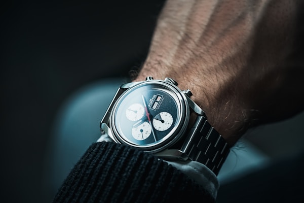 a close up of a person wearing a watch