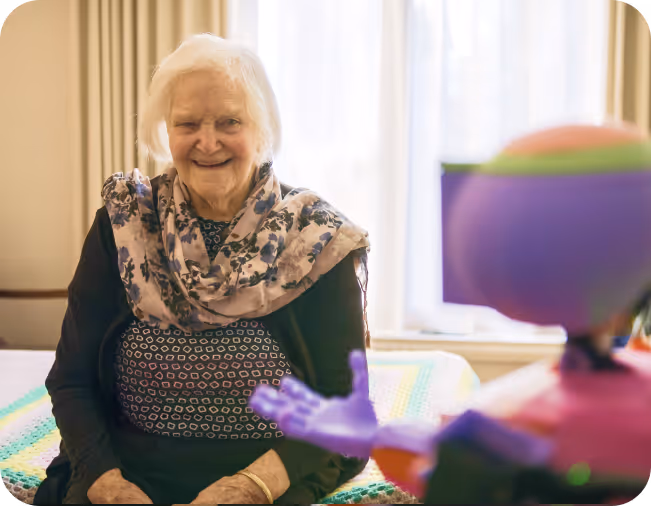 Abi the social companion robot interacts with a female elderly aged care resident