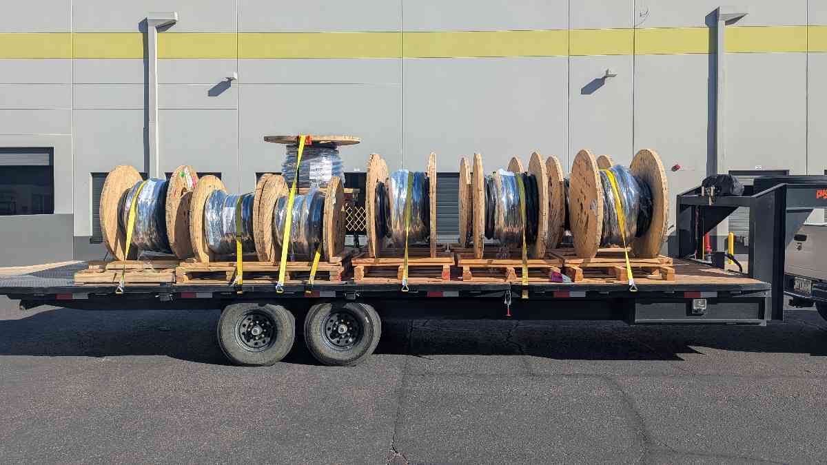 Delivery of nine large reels of cable on a trailer