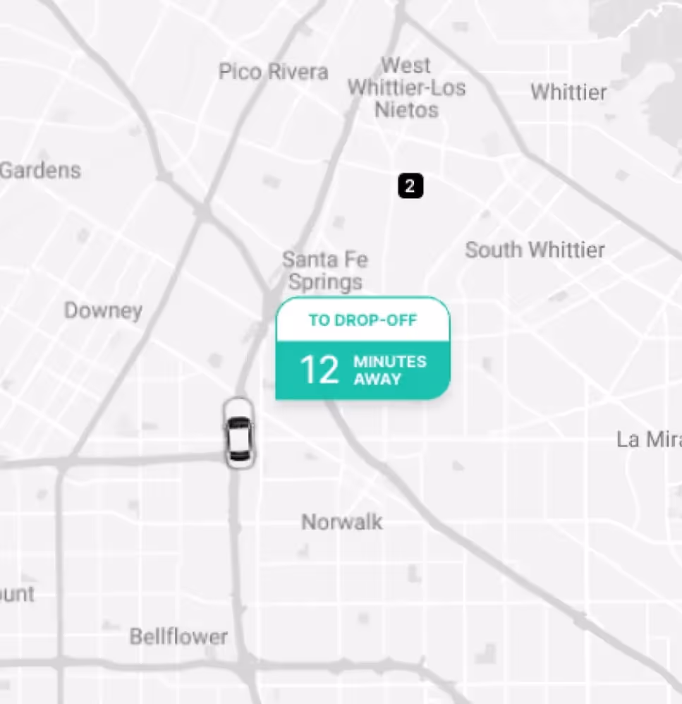 A close-up of Curri’s tracking interface showing a delivery vehicle 12 minutes away from the drop-off location near Santa Fe Springs, with clear navigation and real-time updates.