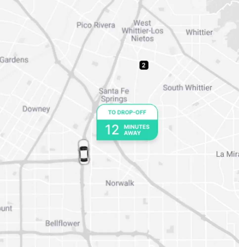 A close-up of Curri’s tracking interface showing a delivery vehicle 12 minutes away from the drop-off location near Santa Fe Springs, with clear navigation and real-time updates.