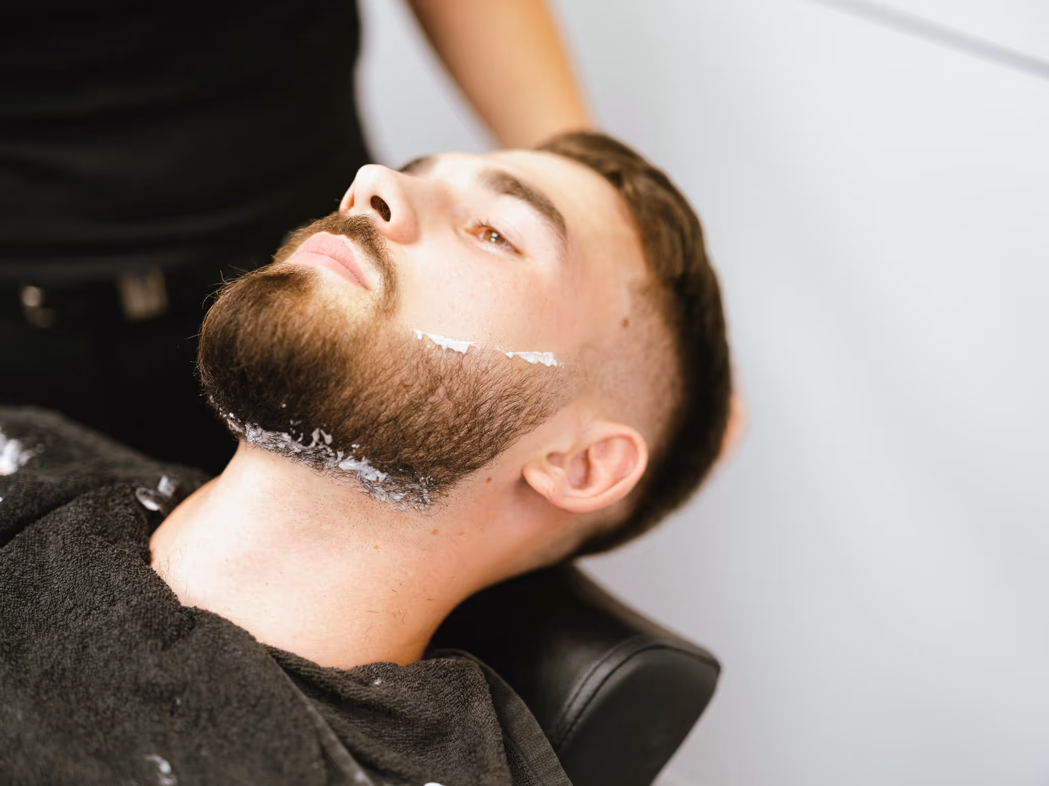 A man about to get a shave