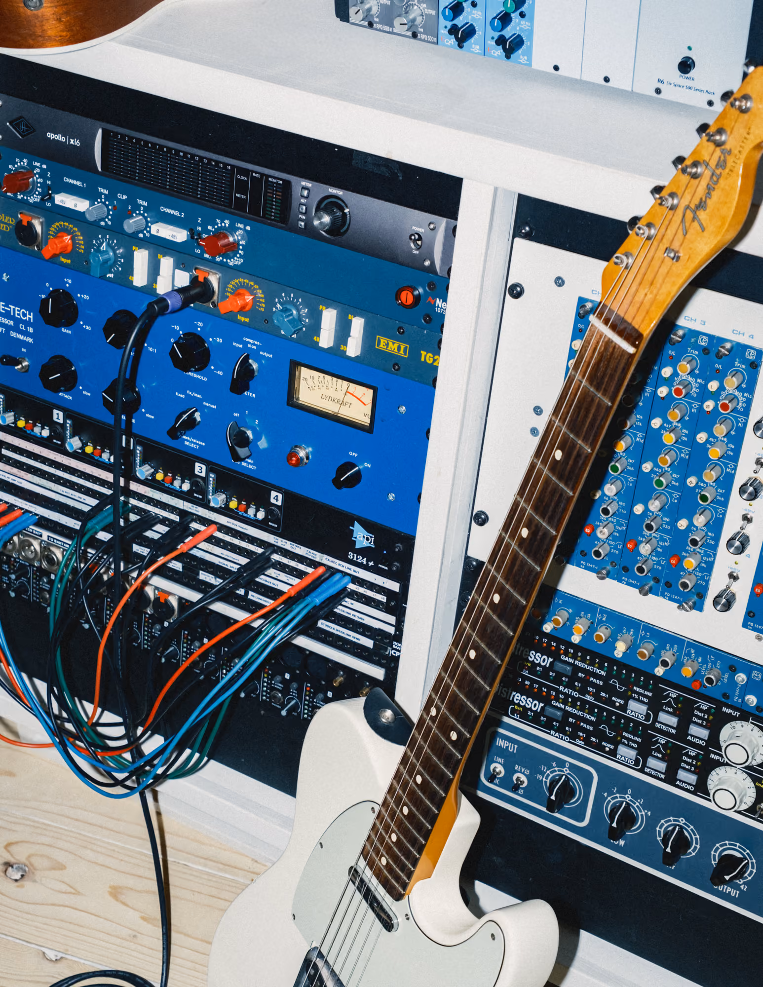 Rack of studio preamps and compressors with an electric guitar at Noatune Studios, London