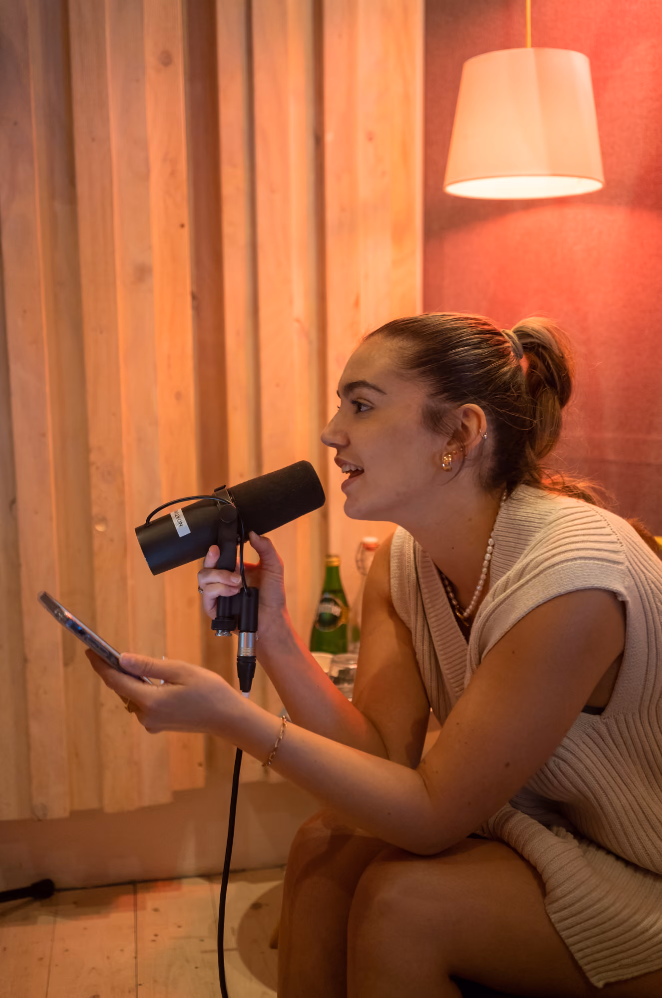 Singer with a handheld microphone during a writing session at Noatune Studios, Hackney