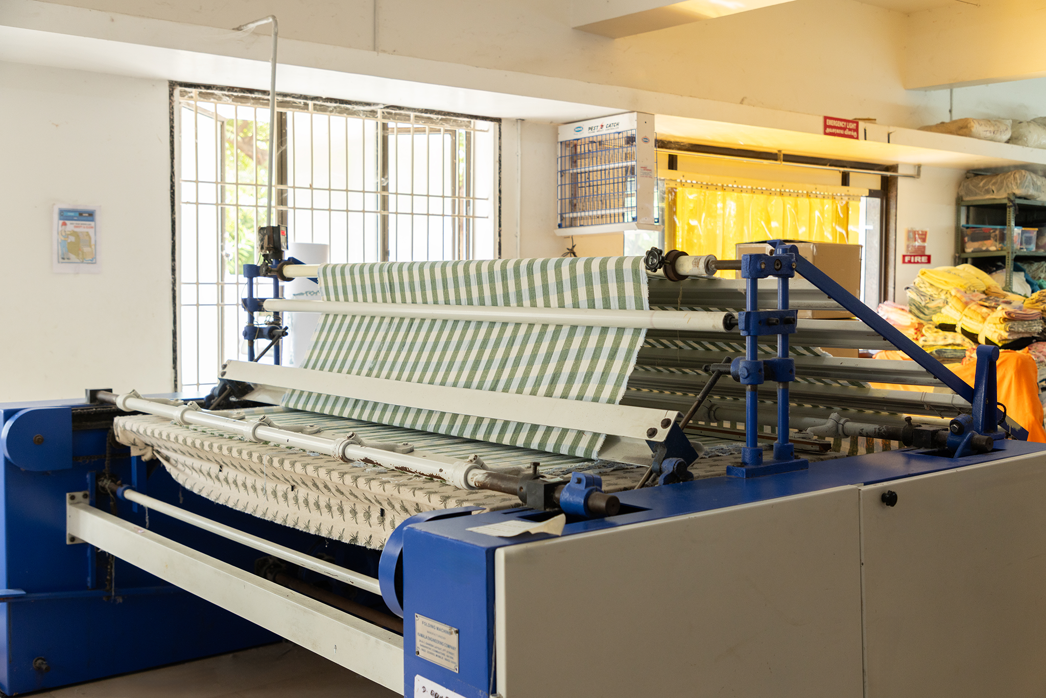 Industrial fabric folding machine anubav fabrics, karur.