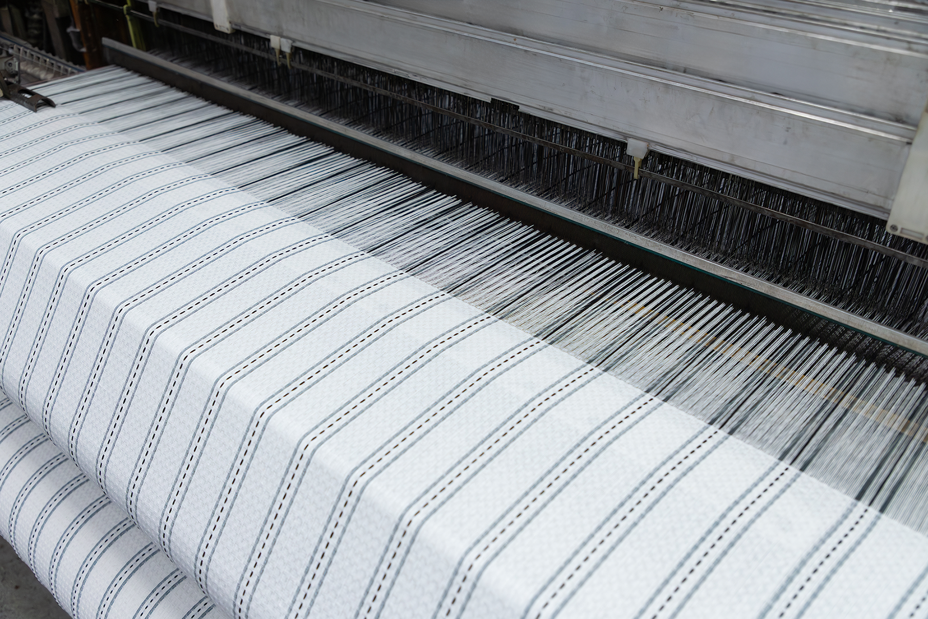 Cotton woven fabric with striped pattern in white and grey color for apparel and home textile use, woven at Anubav Fibres, Karur