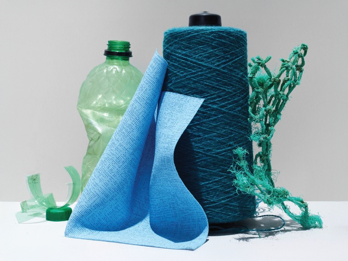 Dyed fabric batches made from cotton fabric in solid dark green are processed for textile finishing and color treatment at Anubav Fabrics, Karur.