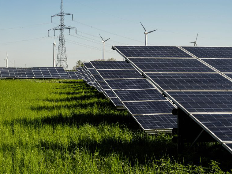 Warp yarn beams made from cotton yarn in plain white are used for fabric weaving and textile production at Anubav Fabrics, Karur.