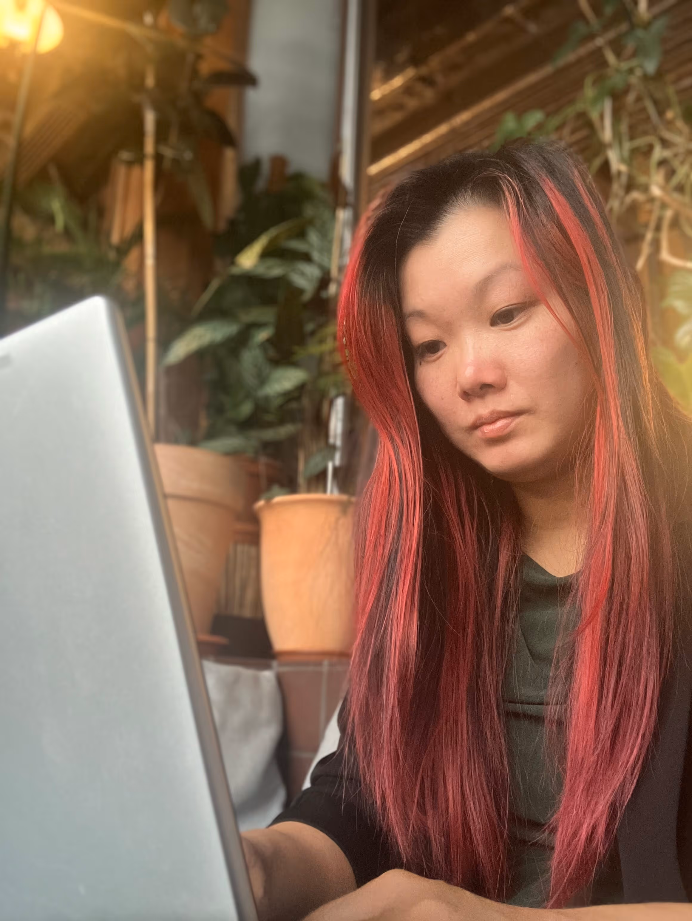 Photo of Amy sat down smiling