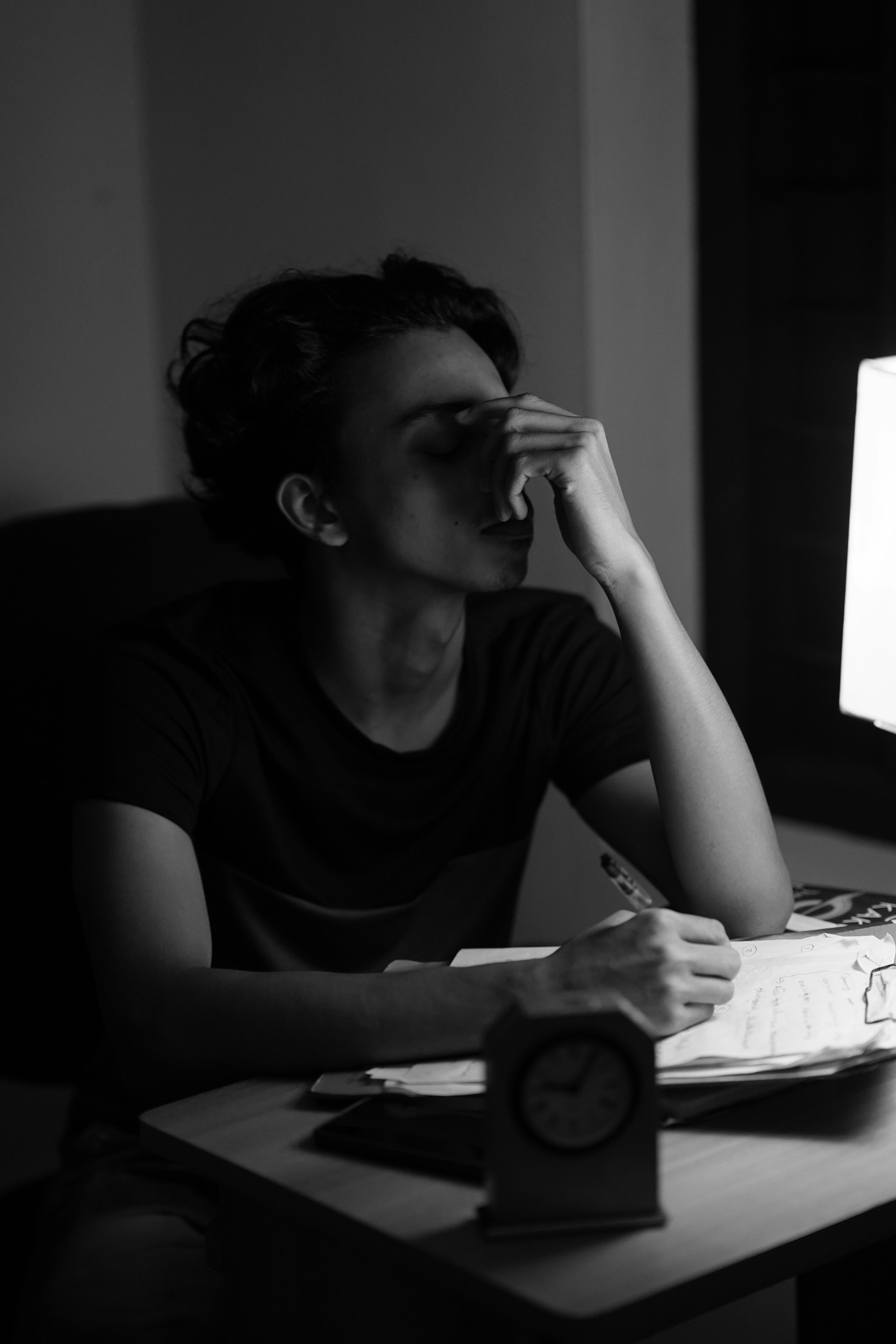 Photo of woman at desk looking tired. Source: Sujin c on Unsplash