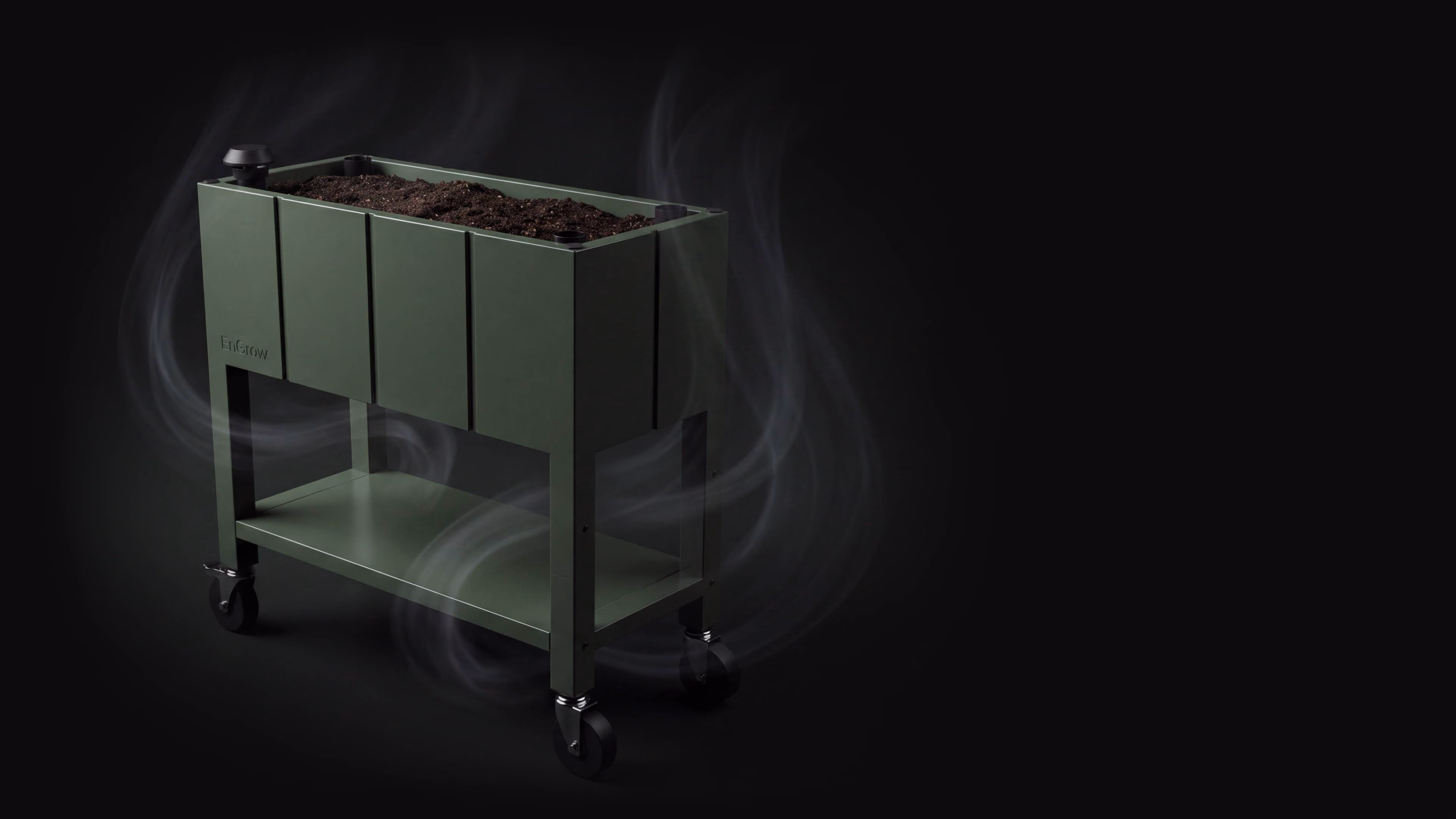 Modern green rectangular raised garden bed on wheels filled with soil, with swirling air around it, set against a dark background. Meant to show how garden bed incorporates oxygen into soil.