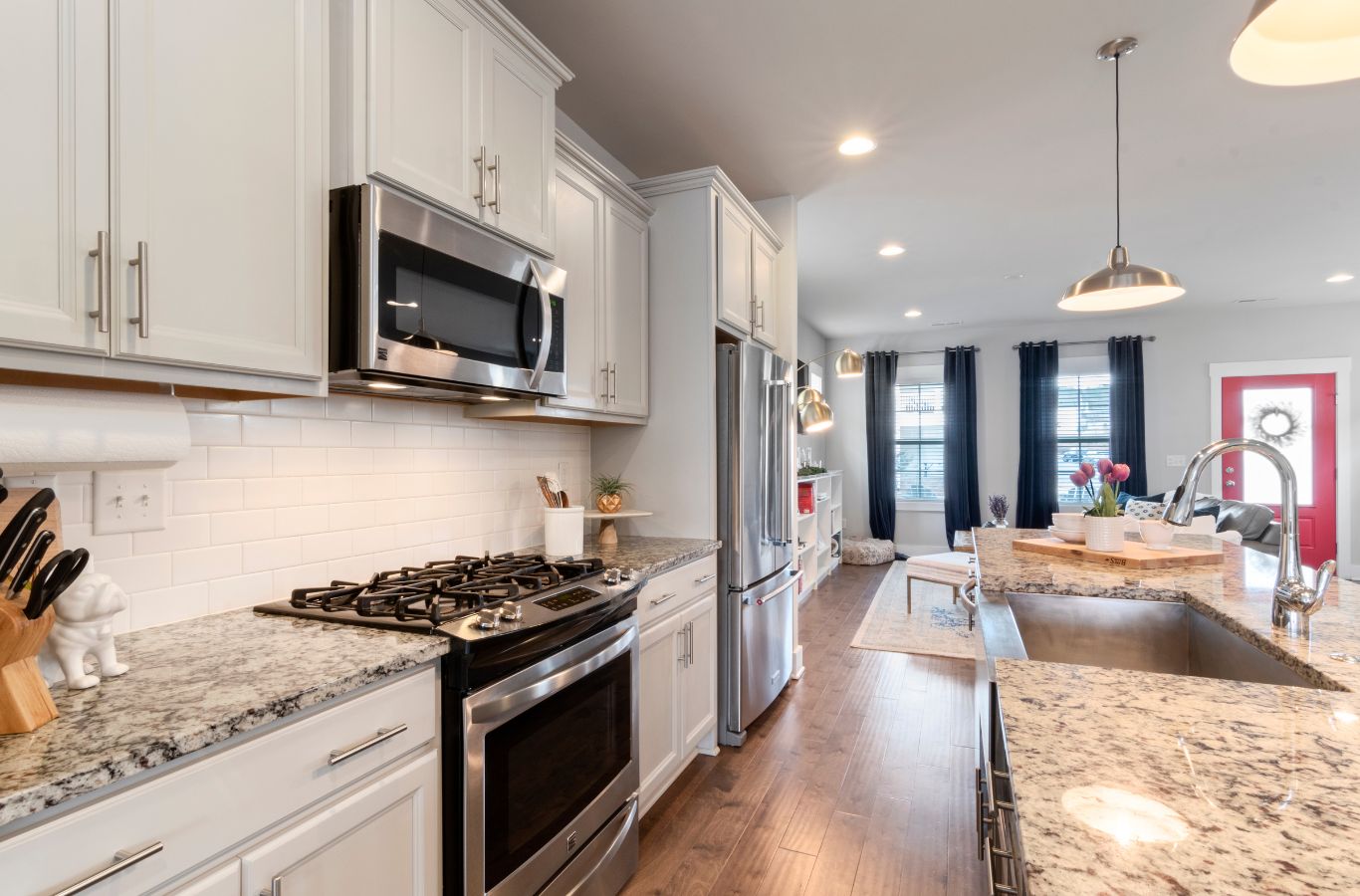 CJM Cleaning team member scrubbing a modern kitchen in Hudson County, NJ, emphasizing the advantages of professional kitchen cleaning services.