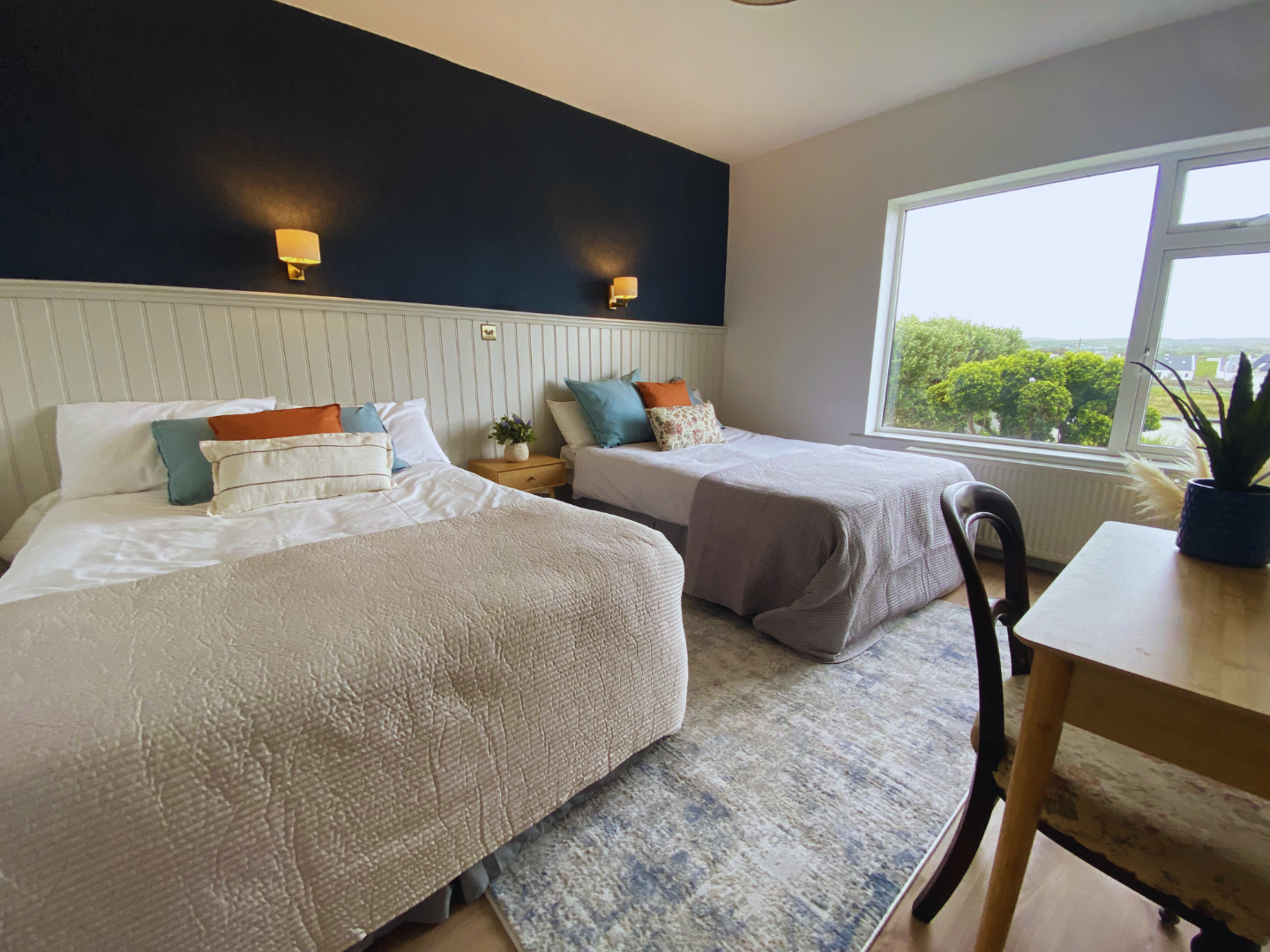 A modern twin room with underfloor heating and private ensuite. 