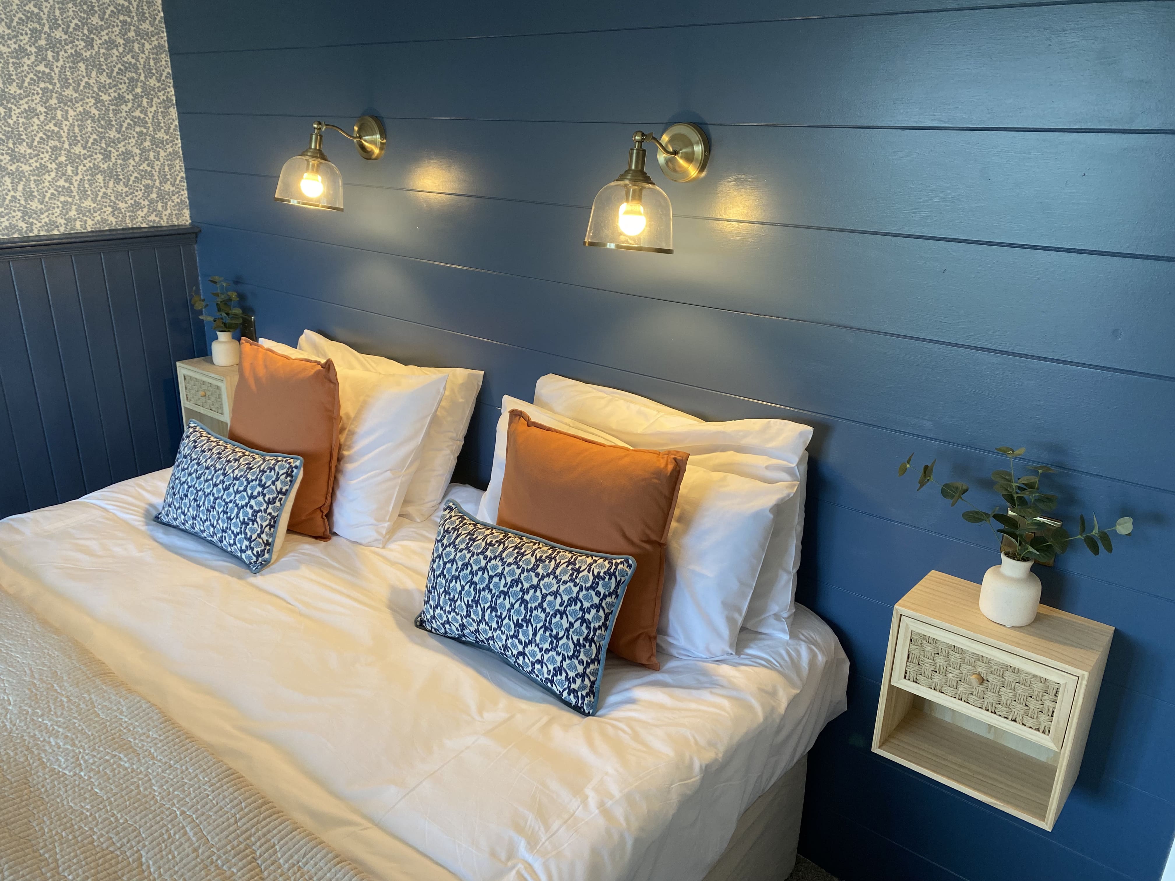 Spacious modern bedroom with superking bed, ensuite and balcony overlooking the garden and ocean view.