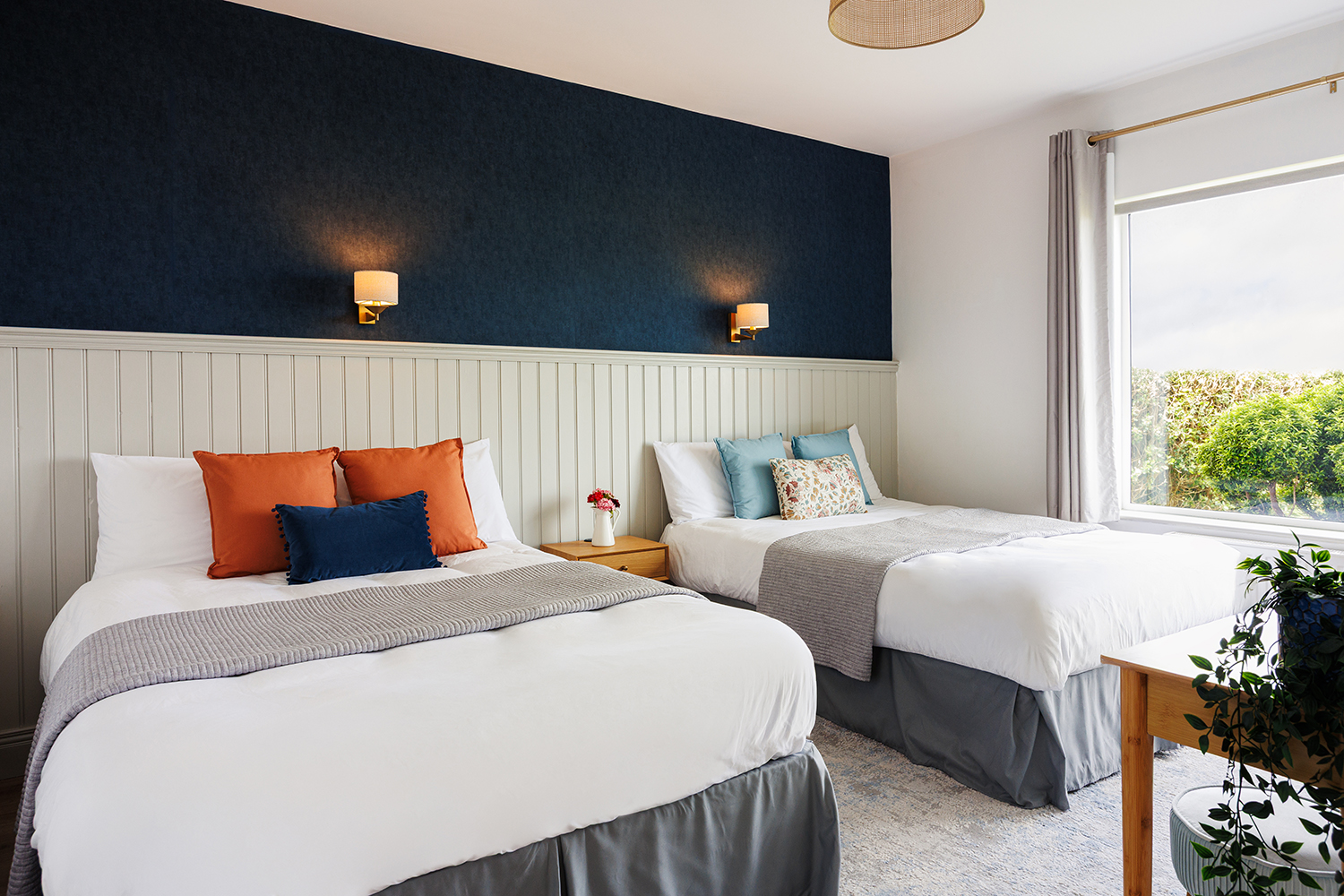 A modern twin room with underfloor heating and private ensuite.
