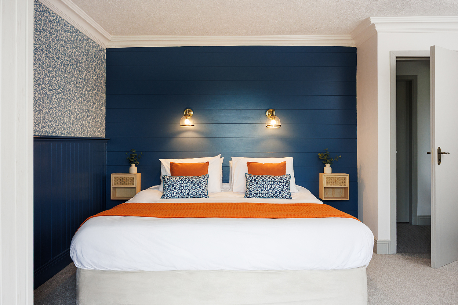Spacious modern bedroom with superking bed, ensuite and balcony overlooking the garden and ocean view.