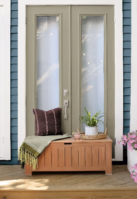 Front porch featuring Artifact-painted siding and entry door, offering a fresh exterior look that complements natural wood and outdoor accents.