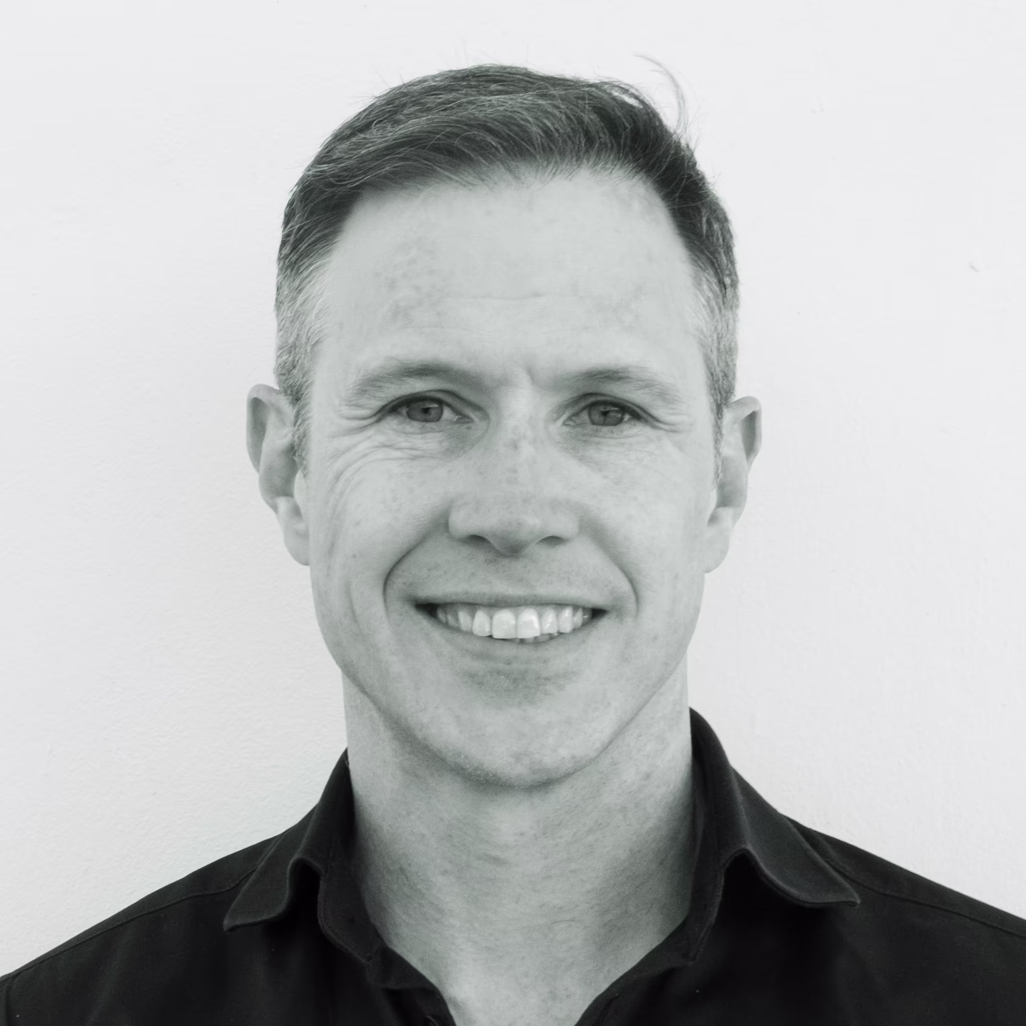 a greyscale photo of Alex